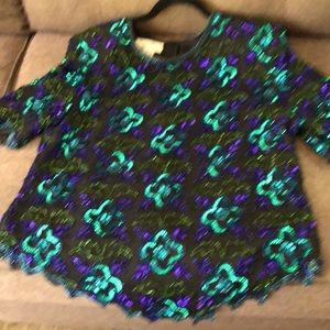 Beaded mid-sleeved top with hidden back zipper.